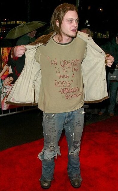 An ORGASM Is Better Than A BOMB Bernardo Bertolucci quote shirt as worn by Michael Pitt