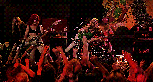 L7 as Camel Lips in Serial Mom setting fire GIF