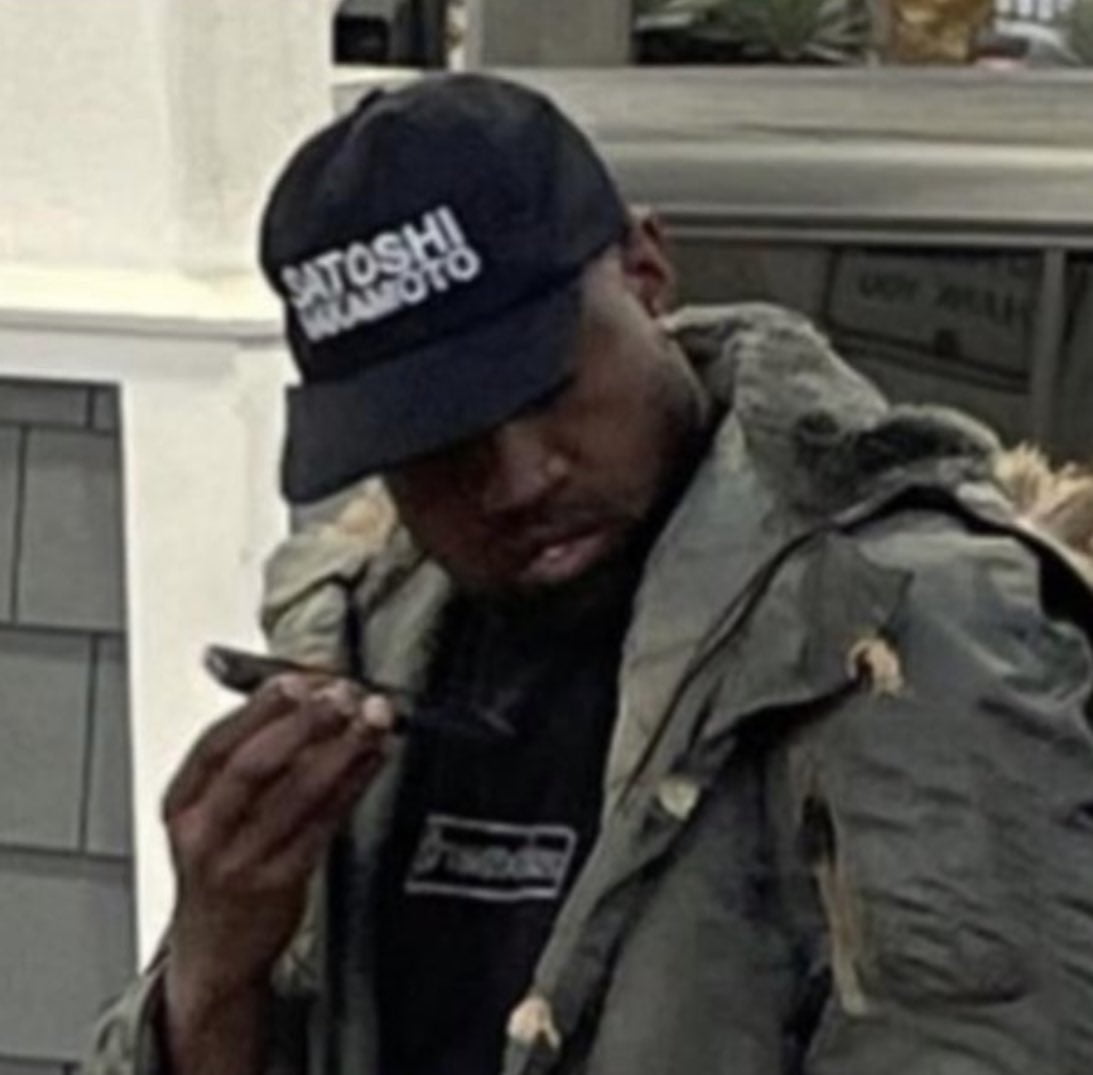 Kanye West wearing a Satoshi Nakamoto hat