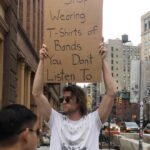 Stop Wearing T-Shirts of Bands You Don't Listen To - Protest Sign