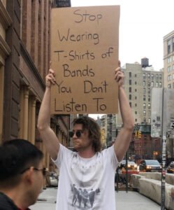Stop Wearing T-Shirts of Bands You Don't Listen To - Protest Sign