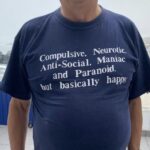 Compulsive, Neurotic, Anti-Social, Maniac and Paranoid but basically happy T-Shirt