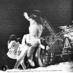 Slash naked fucking a blow up doll on stage