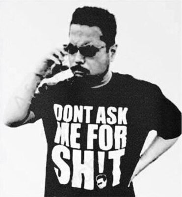 Katsuhiro Harada wearing Dont Ask Me For Shit shirt