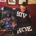 6ix9ine in his HIV HOE outfit