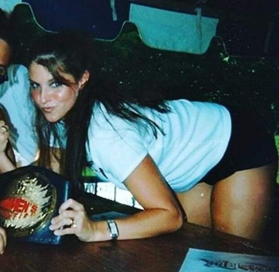 A younger Stephanie McMahon when she was the WWE women’s champion.