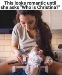 A Woman Shaving Her Boyfriend With A Blade