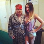 Axl Rose with a young and sexy groupie