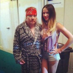 Axl Rose with a young and sexy groupie