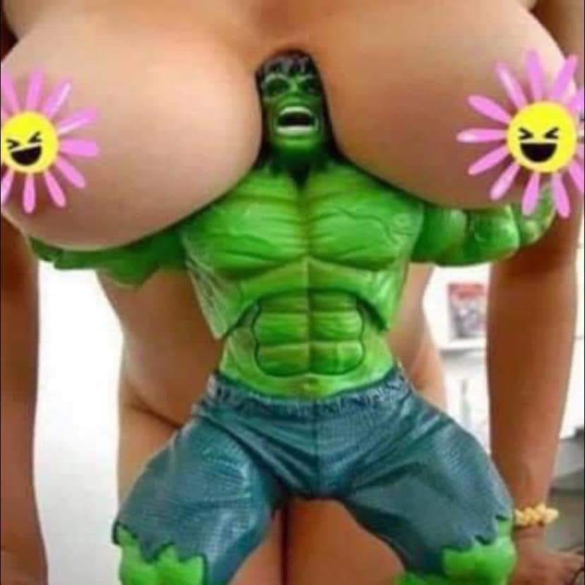 Hulk action figure between big tits