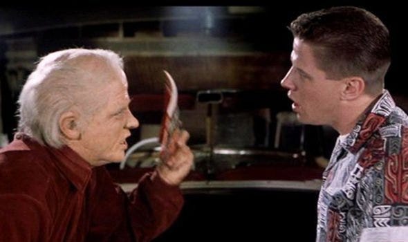 Old Biff Tannen giving the Sports Almanac to young Biff